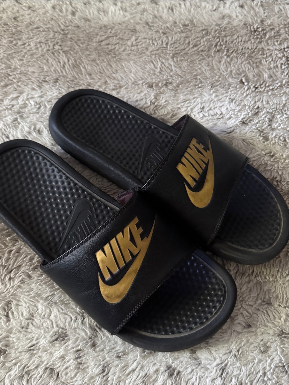 Nike Black Slides with Gold Swoosh